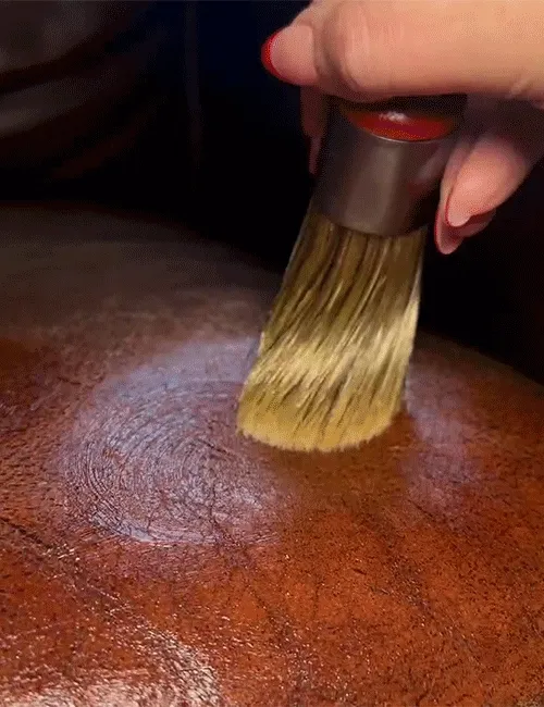 Animated close-up of brush application on leather